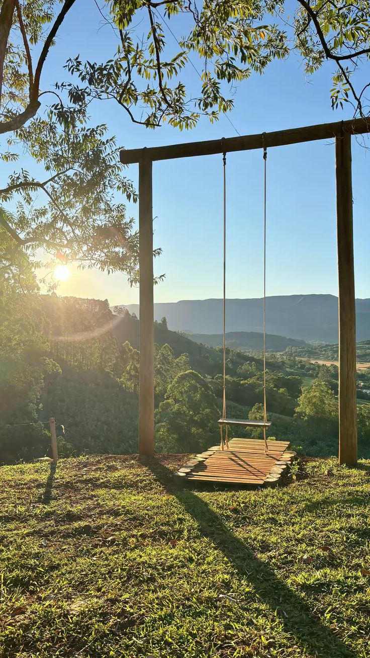 Misty sunrise over the rolling green hills of Wayanad, capturing the tranquil beauty that surrounds Gruha Stay.